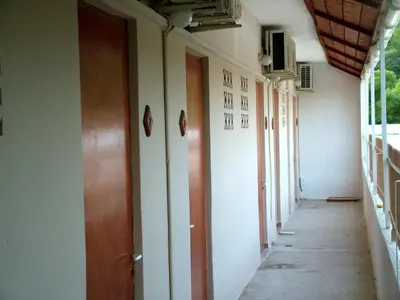 an empty hallway of a building with doors on it at George Apartments in Aegina Town