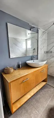a bathroom with a sink and a large mirror at Cozy Near Acropolis by LV in Athens