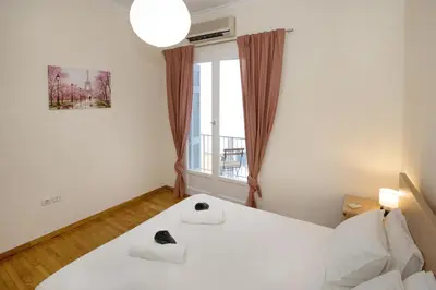 a bedroom with a bed with two towels on it at Modern Rental with Cozy Charm by GHH in Athens