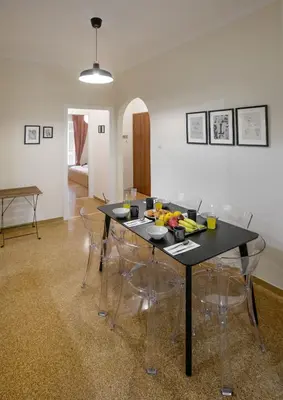 a dining room with a black table and chairs at Modern Rental with Cozy Charm by GHH in Athens