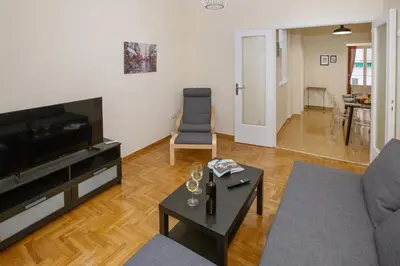 a living room with a couch and a table at Modern Rental with Cozy Charm by GHH in Athens