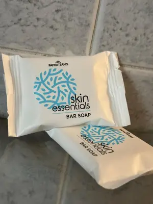 a bag of skin essentials bar soap sitting on the floor at LoftLiving cozy in Athens