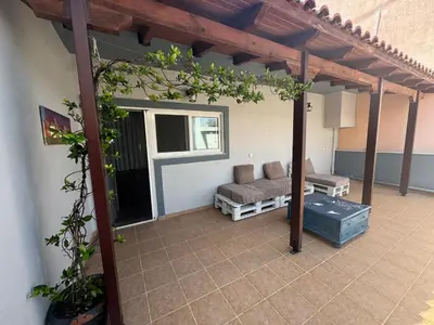 a pergola with a couch on a patio at LoftLiving cozy in Athens