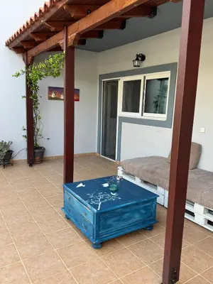 a patio with a blue table in a room at LoftLiving cozy in Athens