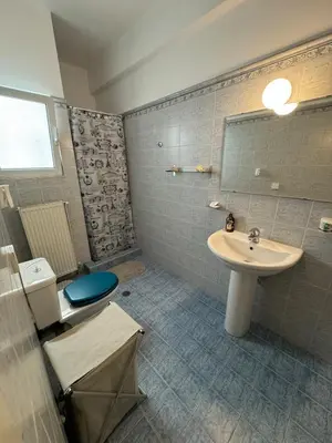 a bathroom with a sink and a toilet at LoftLiving cozy in Athens