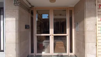 a glass door on the side of a building at Central Apartment Near Acropoli in Athens
