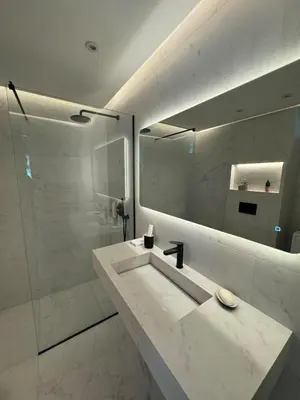 a white bathroom with a sink and a mirror at Blue Paradise Seaview villa with private pool in Sounio