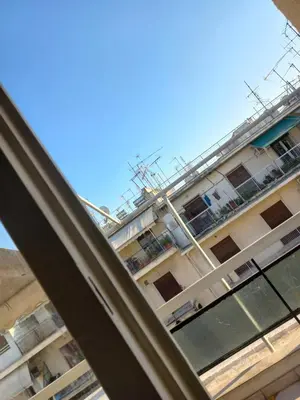 a view of a building from a window at هلال in Athens