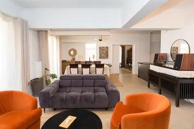 a living room with a couch and a piano at Horizon Haven in Athens
