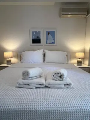 a bedroom with a bed with towels on it at Emerald Lake Loft in Athens