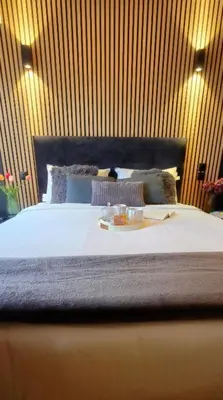 a bed with a tray of food on top of it at Near Acropolis by LV in Athens