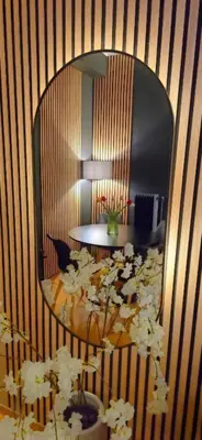 a room with a mirror and a table with flowers at Near Acropolis by LV in Athens