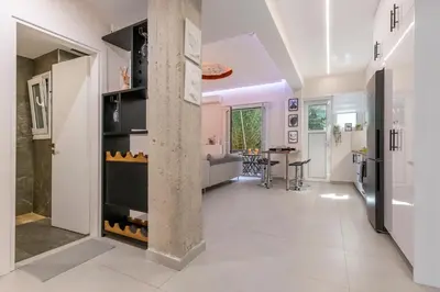 a kitchen and living room with a pillar at Modern Stay in Athens Center in Athens