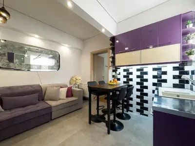 a living room with a couch and a table at Athens Neos Kosmos 2BDR apt next to metro station in Athens