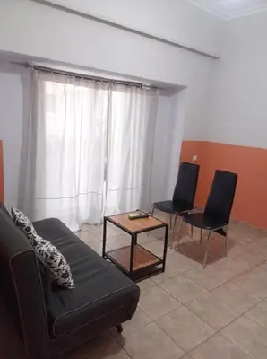 a living room with a couch and two chairs at Happy Rabbit 3 in Athens