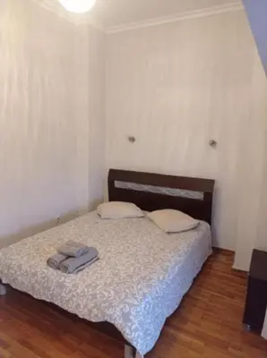 a bedroom with a bed with two towels on it at Happy Rabbit 3 in Athens