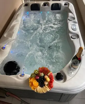 a bath tub with a bowl of fruit in it at illusion 1 in Piraeus