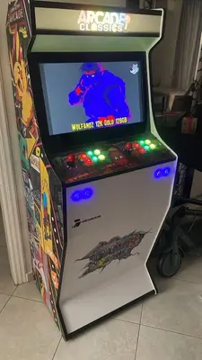 a video game arcade machine with a dinosaur on the screen at illusion 1 in Piraeus