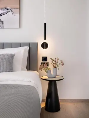 a bedroom with a table next to a bed at Urban K in Athens