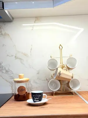 a table with a cup of coffee on it at Casa Marina in Athens