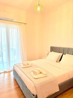 a bedroom with a large bed with towels on it at Casa Marina in Athens