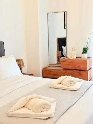 a bedroom with two towels on a bed at Casa Marina in Athens