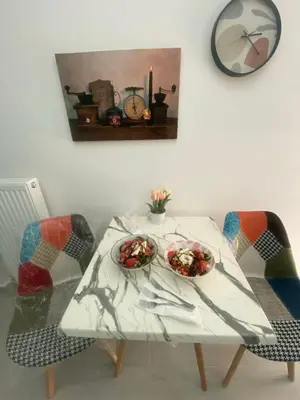 a white table with two bowls of food on it at City apartment in Athens