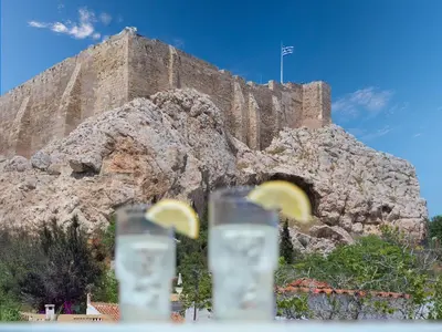 a view of a castle with lemon slices in glasses at The Acropolis Window in Athens