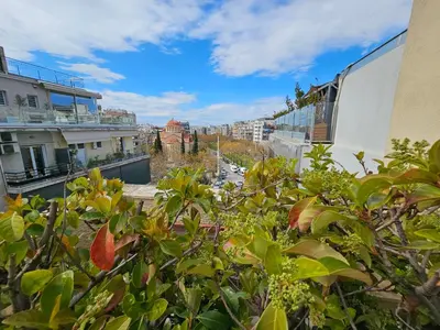 a view of a city from the balcony of a building at Ilissos Terrace Apartment in Athens