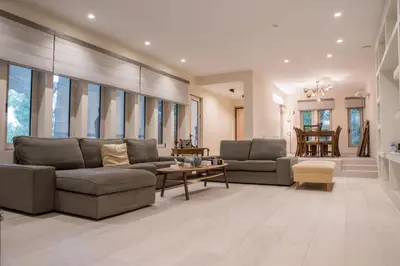 a living room with two couches and a table at Thalia in Athens