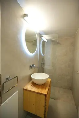 a bathroom with a sink and a mirror at Cozy Exarcheia, 1 BDRM central Apartment in Athens