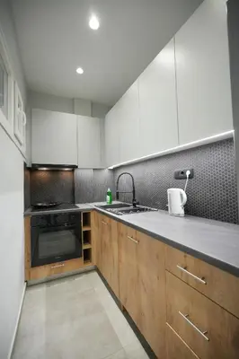 a kitchen with white cabinets and a sink at Cozy Exarcheia, 1 BDRM central Apartment in Athens