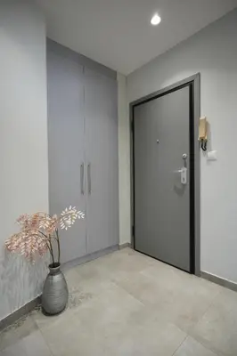 a hallway with a door and a vase with a plant at Cozy Exarcheia, 1 BDRM central Apartment in Athens