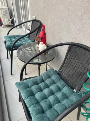two chairs and a table and a table and a toy at Modern Athens Apartment - Close to Metro in Athens