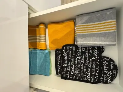 a closet filled with towels at Modern Athens Apartment - Close to Metro in Athens