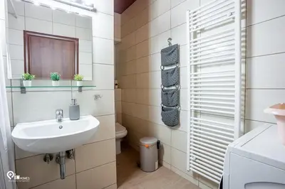 a bathroom with a sink and a toilet at Olympian Zeus - Premium & Luxury Athenian House in Athens