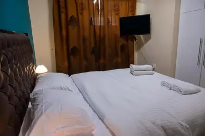 a bedroom with a bed with towels on it at Apartment Margarita in Athens