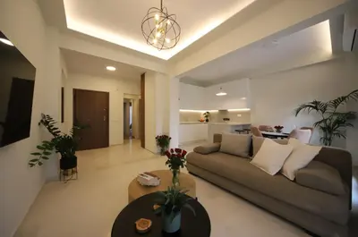 a living room with a couch and a table at Apartment Cathrine in Athens