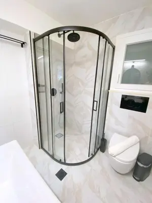 a shower in a bathroom with a toilet at MediTerra Stay Athens Park Place in Athens
