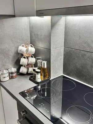 a kitchen with a counter with cups on a stove at Luxury modern chic 1-bedroom apartment Athens City in Athens
