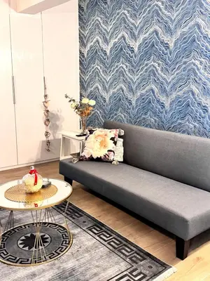a living room with a couch and a table at Modern Athens Escape - Queen Bed & Metro Access in Athens