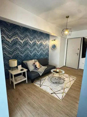 a living room with a couch and a table at Modern Athens Escape - Queen Bed & Metro Access in Athens