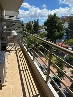 a balcony with a view of a train yard at Παιδων ΣΤΟΥΝΤΙΟ in Athens