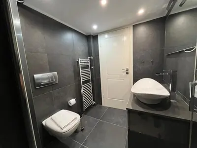 a bathroom with a toilet and a sink in it at Townheart House in Athens in Athens