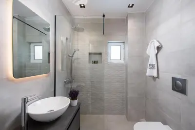 a bathroom with a shower and a sink and a toilet at Glyfada Luxury Suite by First Class Properties in Athens