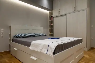 a bedroom with a large bed in a room at Athenian Escape - Located near the heart of Athens in Athens