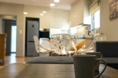 a coffee cup sitting on a table in a room at AMAZING PENTHOUSE FOR SIX person in Athens