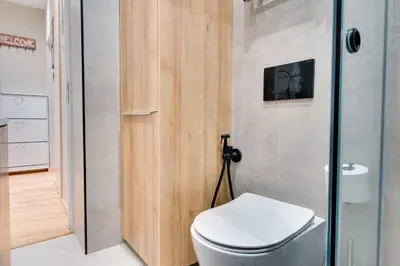 a bathroom with a toilet and a shower at AMAZING PENTHOUSE FOR SIX person in Athens