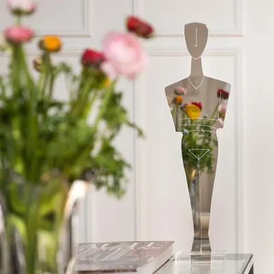 a mannequin with flowers in a vase on a table at Central Athenian Maison, with Acropolis Views in Athens