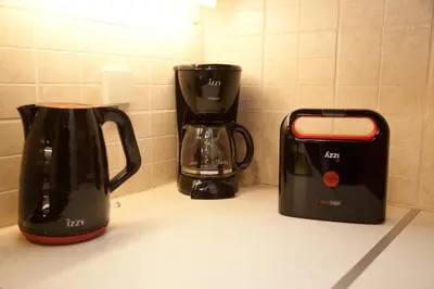 two coffee makers sitting on a kitchen counter at Lovely Nest Piraeus Premium in Piraeus